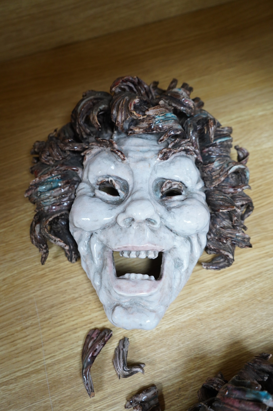 Eugenio Pattarino (1885–1971), two Italian maiolica comedy & tragedy wall masks, 30cm high